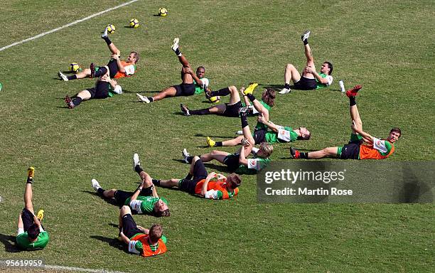 The team of Bremen stretches during the Werder Bremen training session at the Al Wasl training ground on January 7, 2010 in Dubai, United Arab...