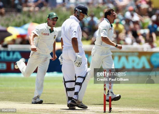 Dale Steyn of South Africa celebrates with AB de Villiers after bowling out Jonathan Trott of England for 42 runs during day five of the third test...