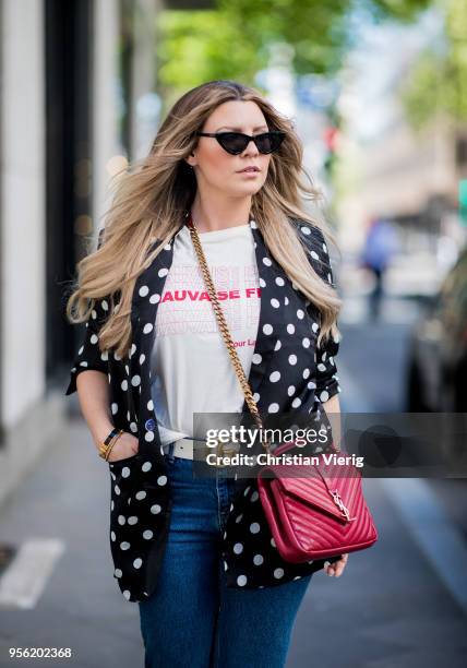 Verena Ahmann wearing a white black satin dots long blazer from Mango, beige red shirt and 7/8 denim pants Sincerely Jules, Off White coloured shoes...