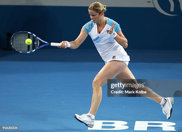 Kim Clijsters of Belgium plays a forehand in her quarter final match against Lucie Safarova of the Czech Republic during day five of the Brisbane...