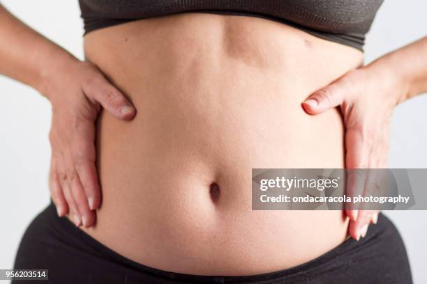 a woman's fat belly - slender waist stock pictures, royalty-free photos & images