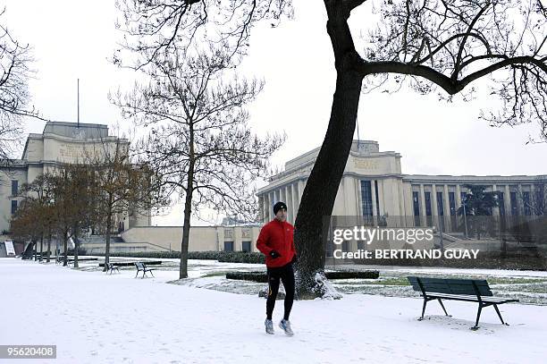 Man joggs on the snow-covered Trocadero gardens on January 7, 2010 in Paris, as Europe shivered in bitterly cold temperatures again. In France, snow...