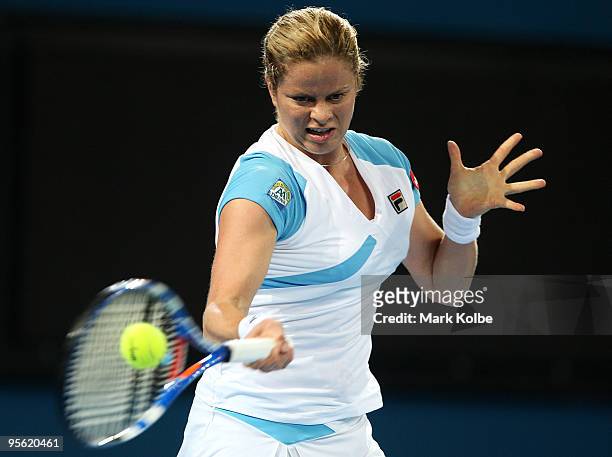 Kim Clijsters of Belgium plays a forehand in her quarter final match against Lucie Safarova of the Czech Republic during day five of the Brisbane...