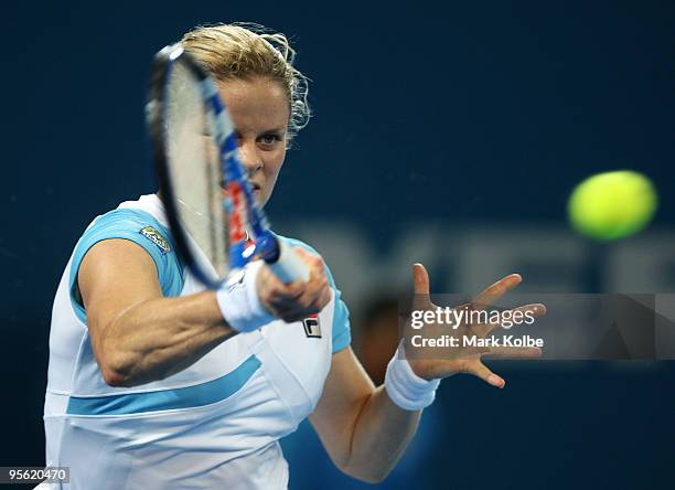 Kim Clijsters of Belgium plays a forehand in her quarter final match against Lucie Safarova of the Czech Republic during day five of the Brisbane...