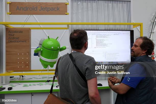 An attendee looks at a monitor displaying code at the Google I/O 2018 Conference at Shoreline Amphitheater on May 8, 2018 in Mountain View,...