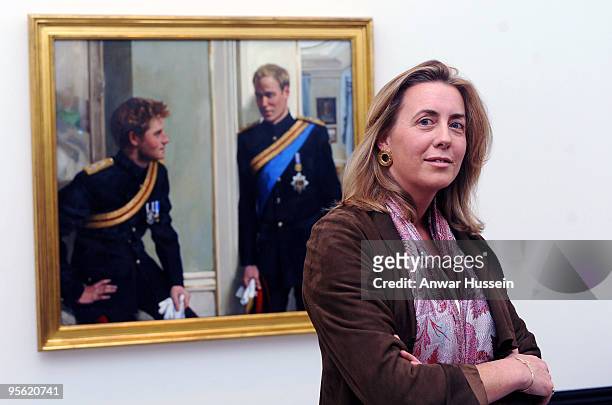 Artist Nicky Phillips stands beside a double portrait she painted of Prince William and Prince Harry which was unveiled at the National Portrait...