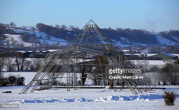 Snow lies on the ground around the skeleton of the main Pyramid stage at the Glastonbury Festival site at Worthy Farm, Pilton on January 7, 2010 in...