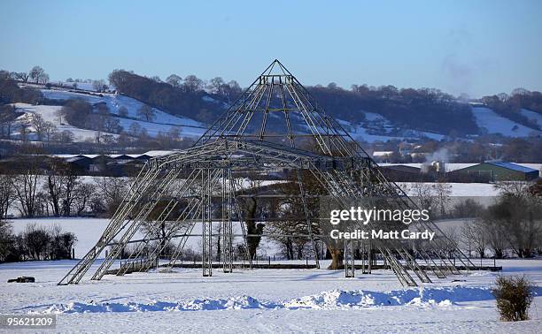 Snow lies on the ground around the skeleton of the main Pyramid stage at the Glastonbury Festival site at Worthy Farm, Pilton on January 7, 2010 in...