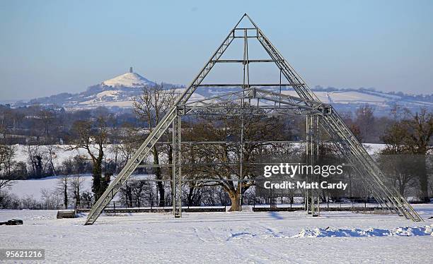 Snow lies on the ground around the skeleton of the main Pyramid stage at the Glastonbury Festival site at Worthy Farm, Pilton on January 7, 2010 in...