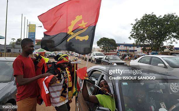 Street vendor sells the Angola's flag and gadgets of Angola national football team on january 7, 2010 in Luanda, three days before the 2010 African...