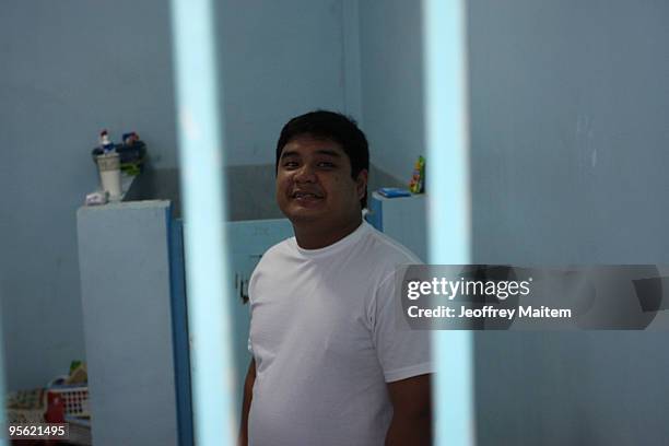 Sajid Ampatuan, suspended governor of Maguindanao province in the southern Philippines stands inside his heavily guarded detention cell as he is...