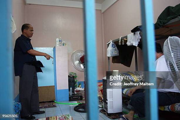 Senior Superintendent Pedro Austria, regional chief of the Philippine National Police Criminal Investigation and Detection Group, inspects the cell...