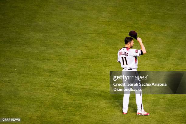 Pollock of the Arizona Diamondbacks tips his cap while being recognized as April's National League Player of the Month during a game against the Los...