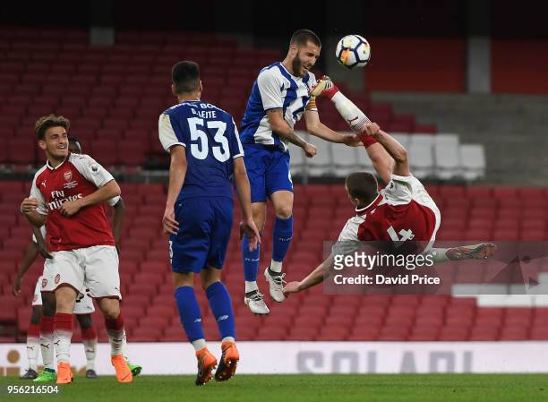 Charlie Gilmour of Arsenal attemps a bicyle kick under pressure from Rui Moreira of Porto during the match between Arsenal and FC Porto at Emirates...
