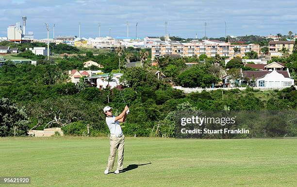 Richard Sterne of South Africa plays his approach shot on the 13th hole during the first round of the Africa Open at the East London Golf Club on...