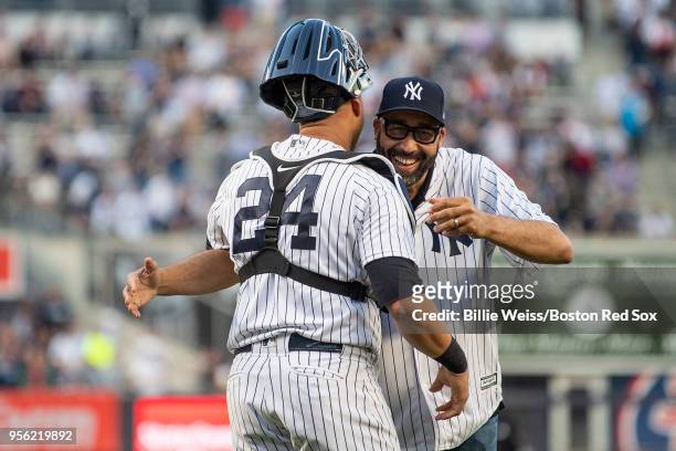New York Knicks head coach David Fizdale reacts with Gary Sanchez of the New York Yankees after throwing out the ceremonial first pitch before a game...