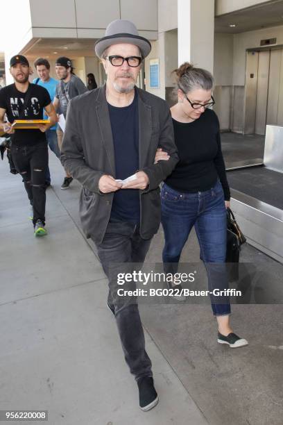 Gary Oldman and his wife, Gisele Schmidt are seen on May 08, 2018 in Los Angeles, California.