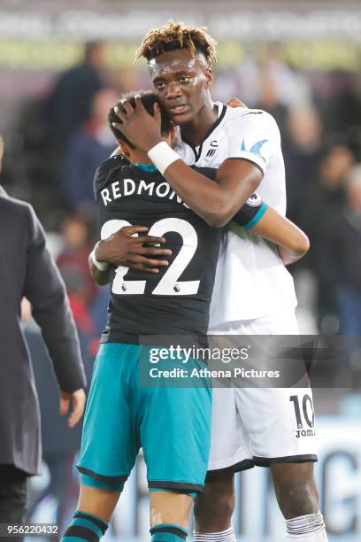 Nathan Redmond of Southampton embraces Tammy Abraham of Swansea City after the end of the game during the Premier League match between Swansea City...