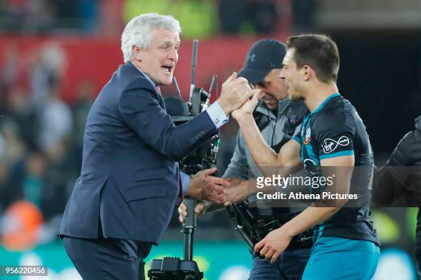 Southampton manager Mark Hughes celebrate his team's win during the Premier League match between Swansea City and Southampton at The Liberty Stadium...