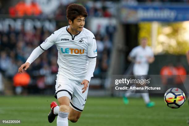 Ki Sung-Yueng of Swansea City in action during the Premier League match between Swansea City and Southampton at The Liberty Stadium on May 08, 2018...