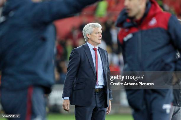 Southampton manager Mark Hughes watches the game from the touch line during the Premier League match between Swansea City and Southampton at The...