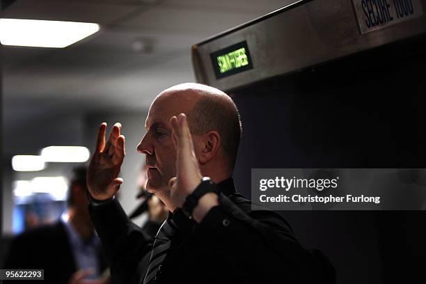 Security officer demonstrates the new full body scanning machine on trial at Manchester Airport on January 7, 2010 in Manchester, England. The...