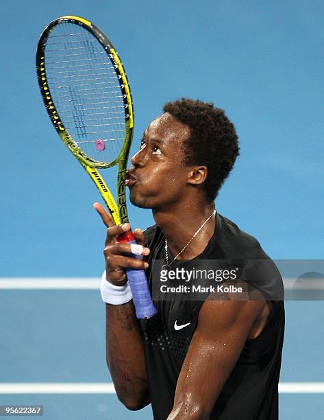 Gael Monfils of France kisses his racquet in his quarter final match against James Blake of the USA during day five of the Brisbane International...
