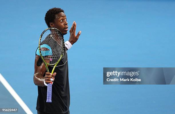 Gael Monfils of France voices his frustration to the chair umpire after a close line call in his quarter final match against James Blake of the USA...