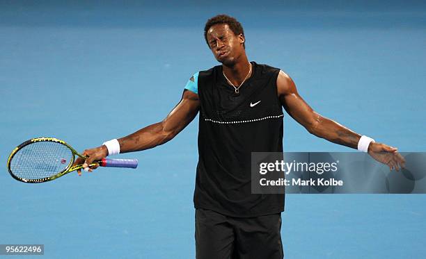 Gael Monfils of France voices his frustration to the chair umpire after a close line call in his quarter final match against James Blake of the USA...