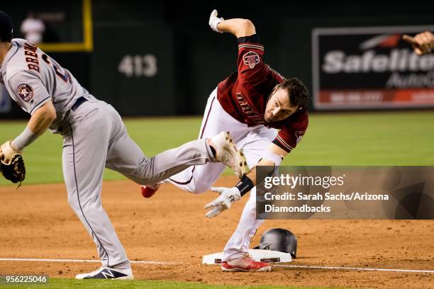 Pollock of the Arizona Diamondbacks runs home to score on an interference error by Alex Bregman of the Houston Astros at third base in the sixth...