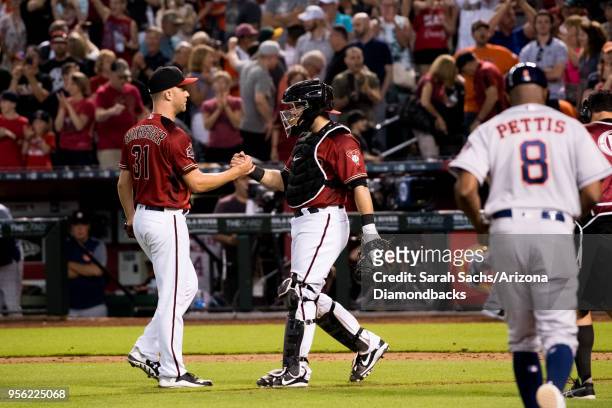 Brad Boxberger and Alex Avila of the Arizona Diamondbacks congratulate each other after defeating the Houston Astros 3-1 at Chase Field on May 6,...