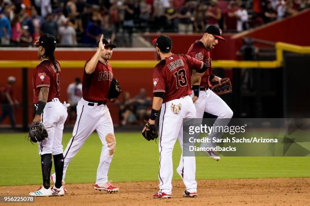 Ketel Marte, A.J. Pollock, Nick Ahmed and David Peralta of the Arizona Diamondbacks celebrate after defeating the Astros 3-1 on May 6, 2018 at Chase...