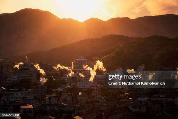 hot stream rising in evening at beppu city japan - beppu bildbanksfoton och bilder