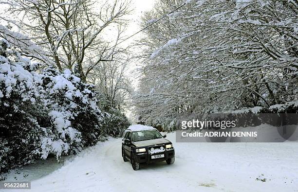 Four wheel drive vehicle is driven along an icy road in Hartley Wintney, in Hampshire, 40 miles west of London, on January 7, 2010. Eurostar...