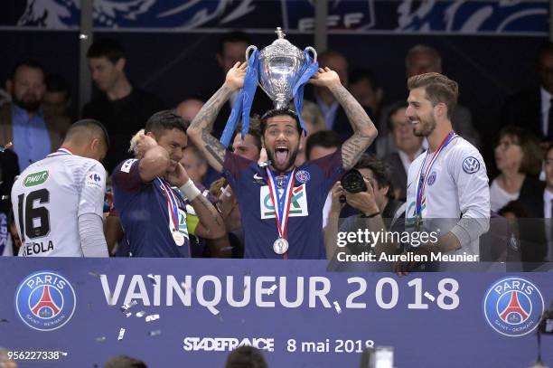 Dani Alves of Paris Saint-Germain poses with the Trophy after the victory over Les Herbiers VF during the Coupe de France Final between Les Herbiers...
