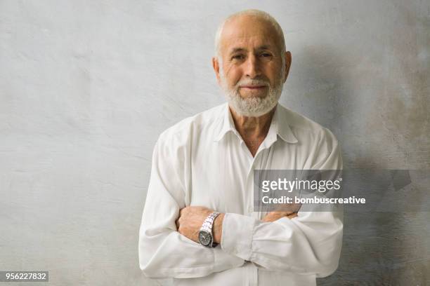 portrait of a smiling senior business man - west asia stock pictures, royalty-free photos & images