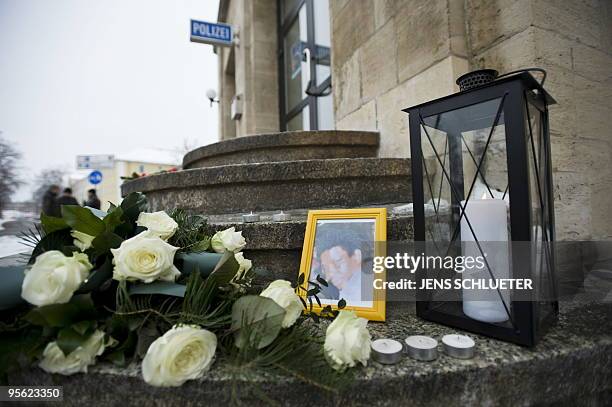 Candles have been lit at a makeshift memorial site for the asylum seeker from Sierra Leone Oury Jalloh outside a police station in the eastern German...