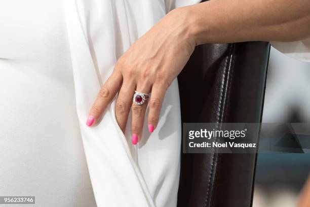 Eva Longoria, jewelry detail, visits "Extra" at Universal Studios Hollywood on May 8, 2018 in Universal City, California.