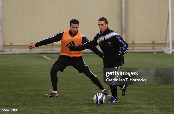 Steven Taylor shadows Peter Lovenkrands during a Newcastle United training session at the Little Benton center on January 7, 2010 in Newcastle,...