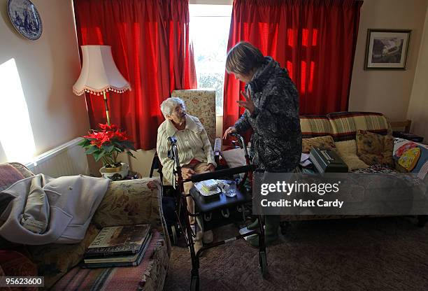 Sue Gardiner manages to deliver meals-on-wheels to elderly residents of High Littleton on January 7, 2010 in Somerset, England. Because of the...