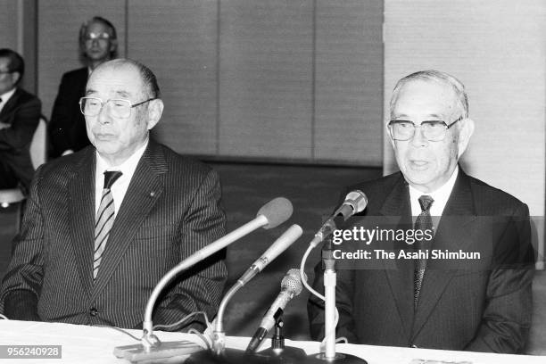 Keidanren, Japan Business Federation new Chairman Gaishi Hiraiwa speaks while outgoing Chairman Eishiro Saito listens during a press conference at...