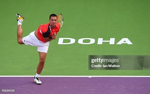 Viktor Troicki of Serbia in action against Lukasz Kubot Poland during the quarter final match of the ATP Qatar ExxonMobil Open at the Khalifa...