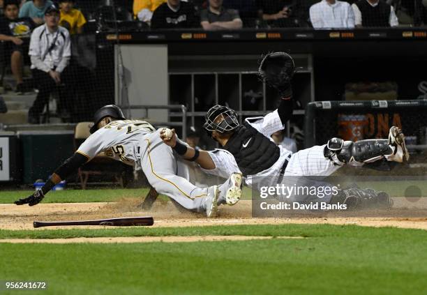 Welington Castillo of the Chicago White Sox tags out Gregory Polanco of the Pittsburgh Pirates at home plate during the second inning on May 8, 2018...