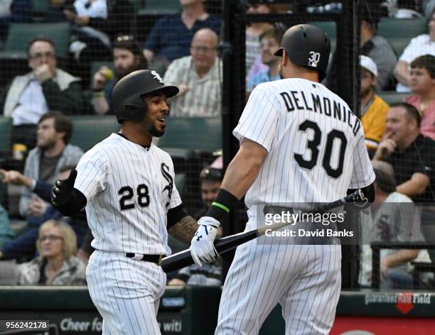 Leury Garcia of the Chicago White Sox is greeted by Nicky Delmonico after scoring against the Pittsburgh Pirates during the first inning on May 8,...