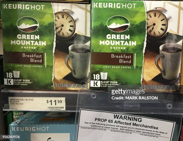 Health warning label beside coffee for sale is seen at a store in Los Angeles, California on May 8, 2018. - A Los Angeles judge has affirmed a ruling...