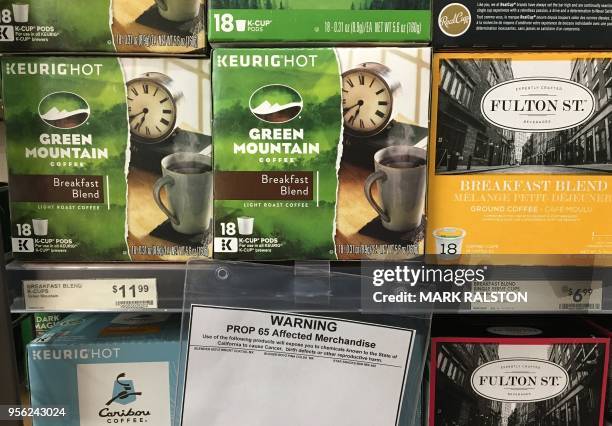 Health warning label beside coffee for sale is seen at a store in Los Angeles, California on May 8, 2018. - A Los Angeles judge has affirmed a ruling...
