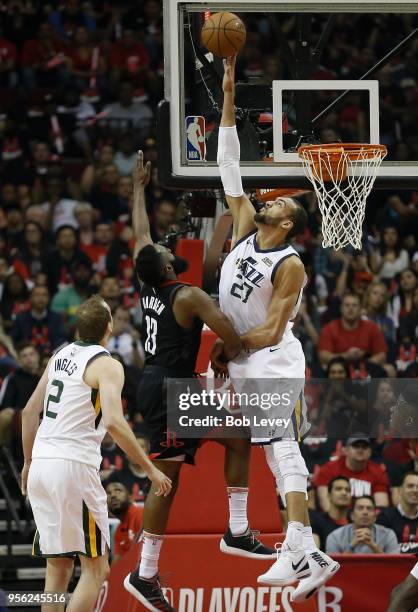 Rudy Gobert of the Utah Jazz blocks the shot attempt by James Harden of the Houston Rockets as Joe Ingles looks on during the fiorst half of Game...