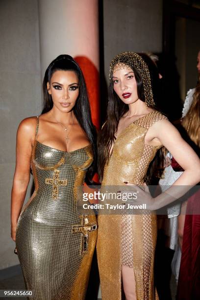 Kim Kardashian West and Olivia Munn attend Heavenly Bodies: Fashion & The Catholic Imagination Costume Institute Gala at The Metropolitan Museum of...