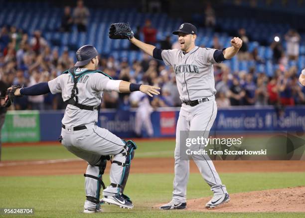 James Paxton of the Seattle Mariners is congratulated by Mike Zunino and teammates after throwing a no-hitter during MLB game action against the...