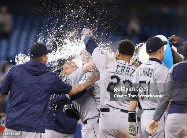 James Paxton of the Seattle Mariners is congratulated by teammates after throwing a no-hitter during MLB game action against the Toronto Blue Jays at...